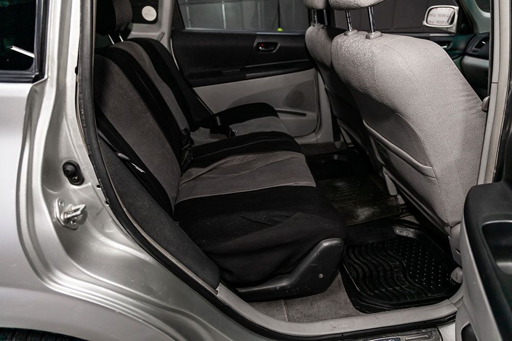 Close-up of custom Toyota seat covers in a family SUV with two-tone stitching